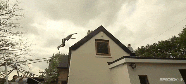 Watch this mad man use a swing set to jump and fly over an entire house
